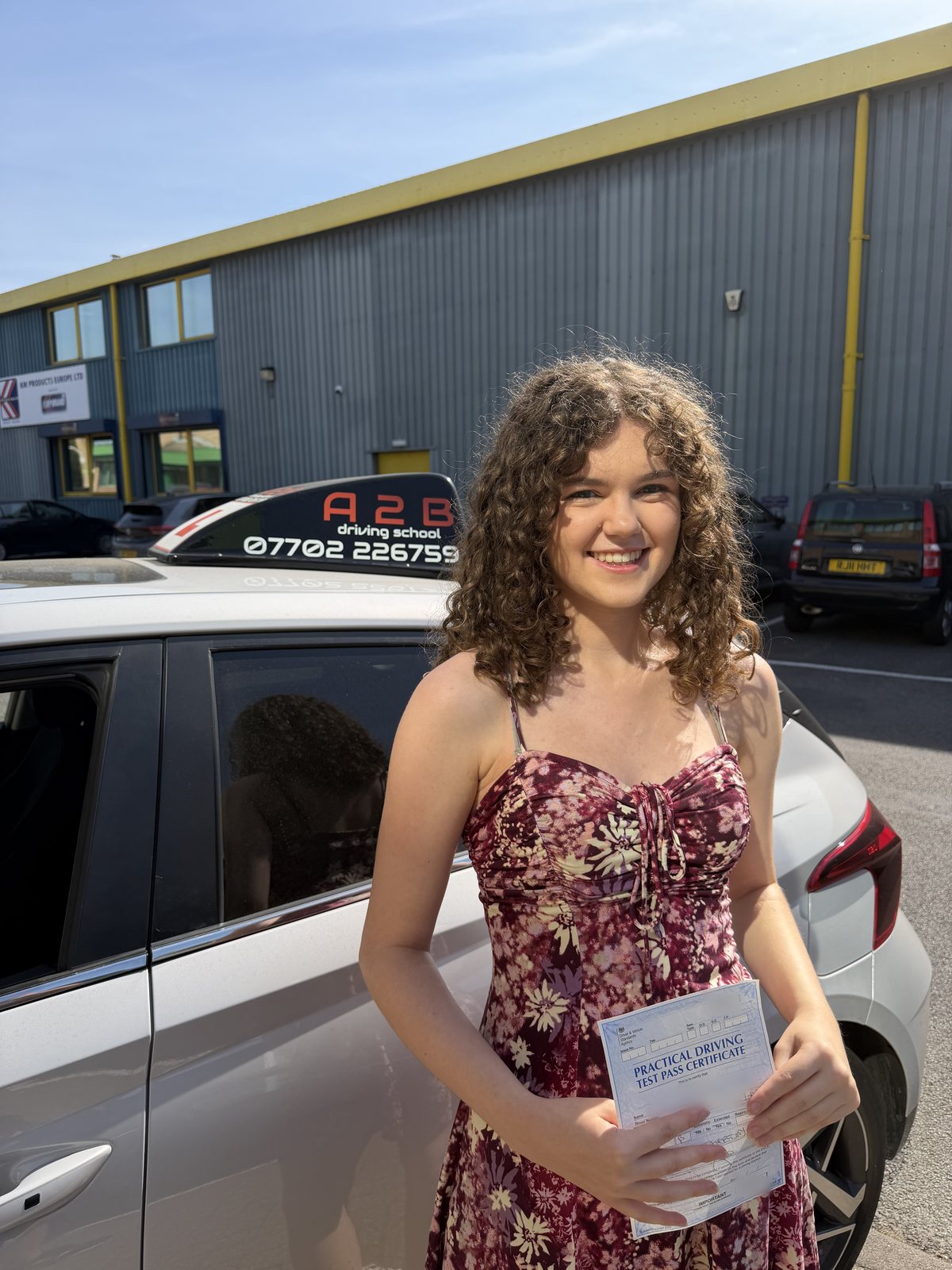 A2B student holding their driving test pass certificate