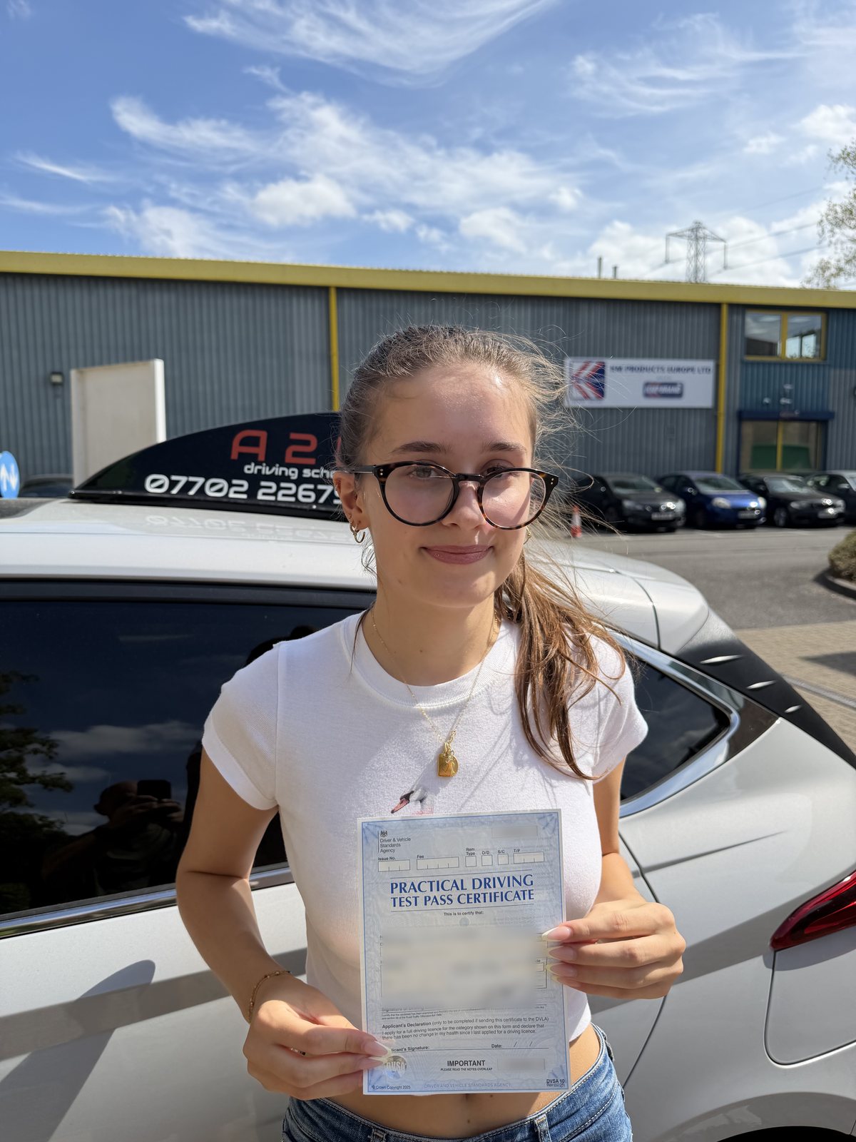 A2B student holding their driving test pass certificate